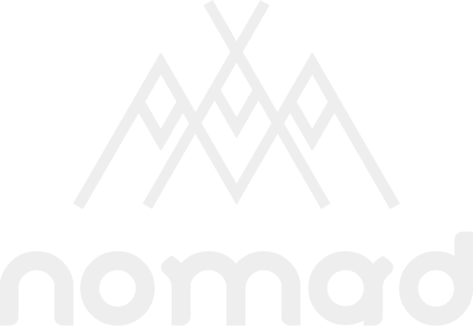 Logo featuring stylized mountain peaks above the word "nomad."